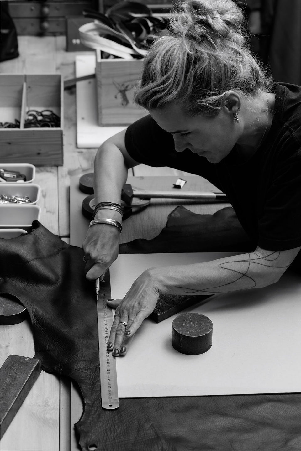 Juul cutting leather at Atelier Jume