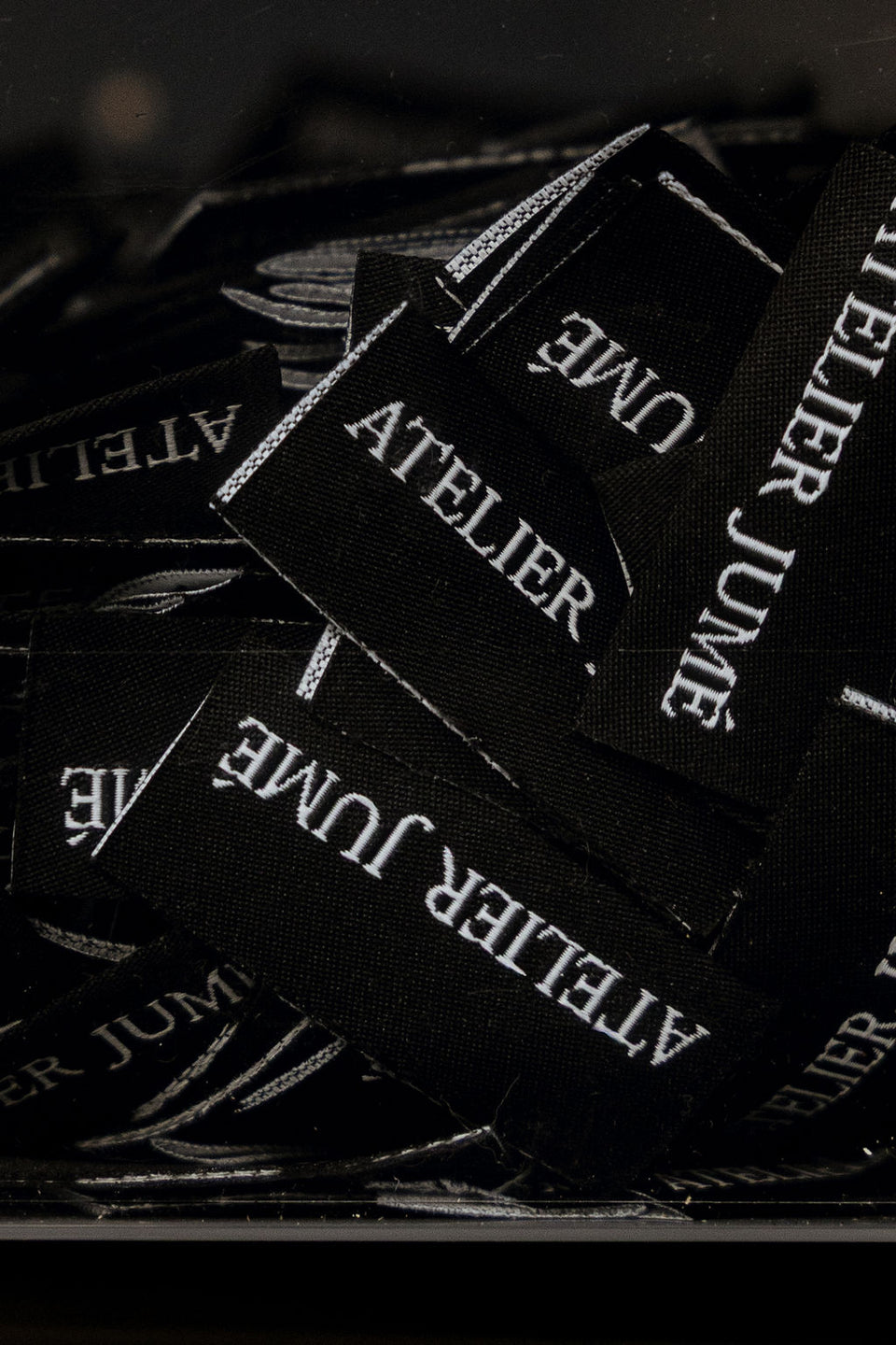 Atelier Jumé leather labels close-up